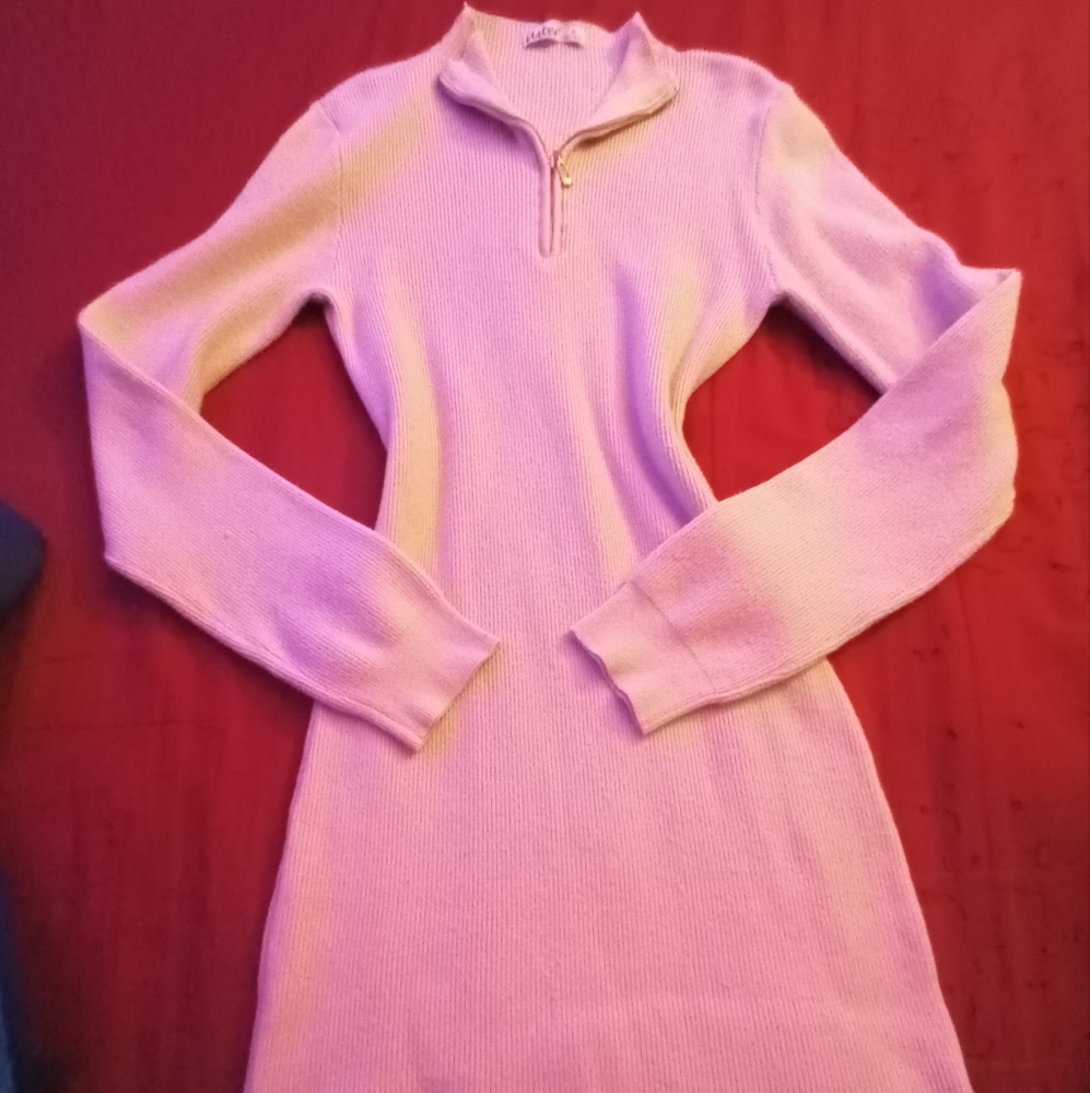 Stretchable beige medium dress with long sleeves.